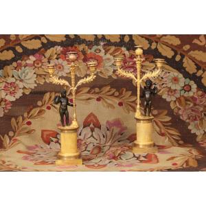 Pair Of Three-light Candelabra Decorated With A Cupid, Gilded And Patinated Bronze, 19th Century