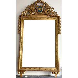 Large Louis XVI Period Mirror In Carved And Gilded Wood
