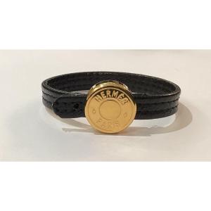Hermès - Bracelet In Gold Metal And Black Leather  