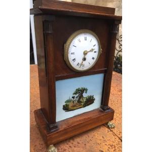 Small Clock Fixed Under Romantic Glass