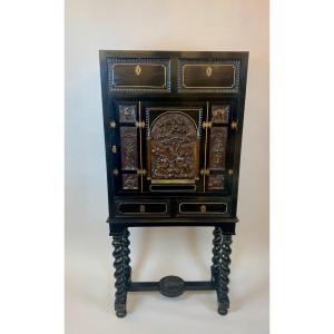 Blackened Wood Cabinet Carved With A Scene Depicting Adam And Eve In The Garden Of Eden