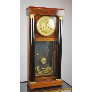 Empire Pendulum In Mahogany, Black Poly Wood, And Gilt Bronze Ornamentation