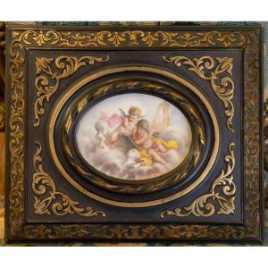 Two Putti On Porcelain With Attributes Of The Arts