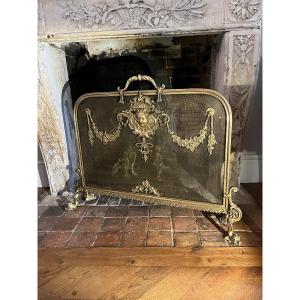 Bronze Spark Guard Decorated With A Woman's Mask Niii