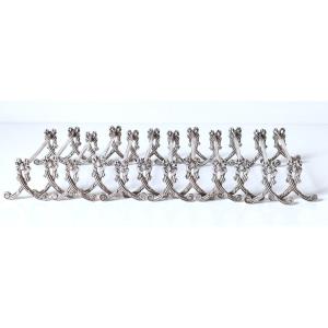 Twelve Solid Silver Knife Rests 