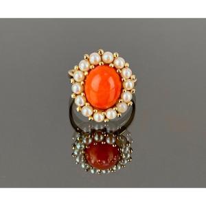 Gold Ring Adorned With A Coral Surrounded By Pearls