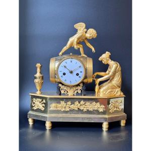 Empire Clock "young Woman And Cupid Drawing Wine From The Barrel" In Gilded Bronze 