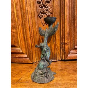 A Bronze Candlestick With Dolphin And Cherub, 19th C.