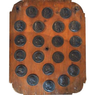 A Wooden Plate Containing Medals