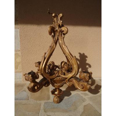 A Chandelier In Golden Wood