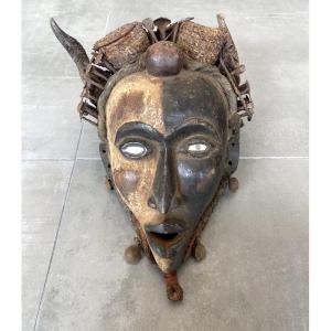 African Mask Made Of Carved Wood And Straws