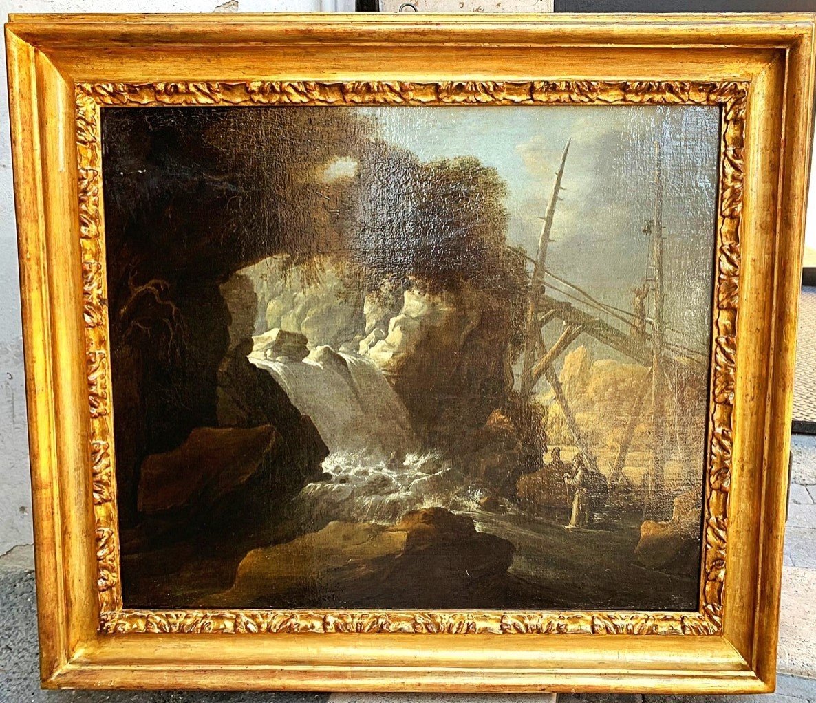 Paesaggio con cascata e personaggi, olio su tela della 2a metà del Seicento in cornice coeva.