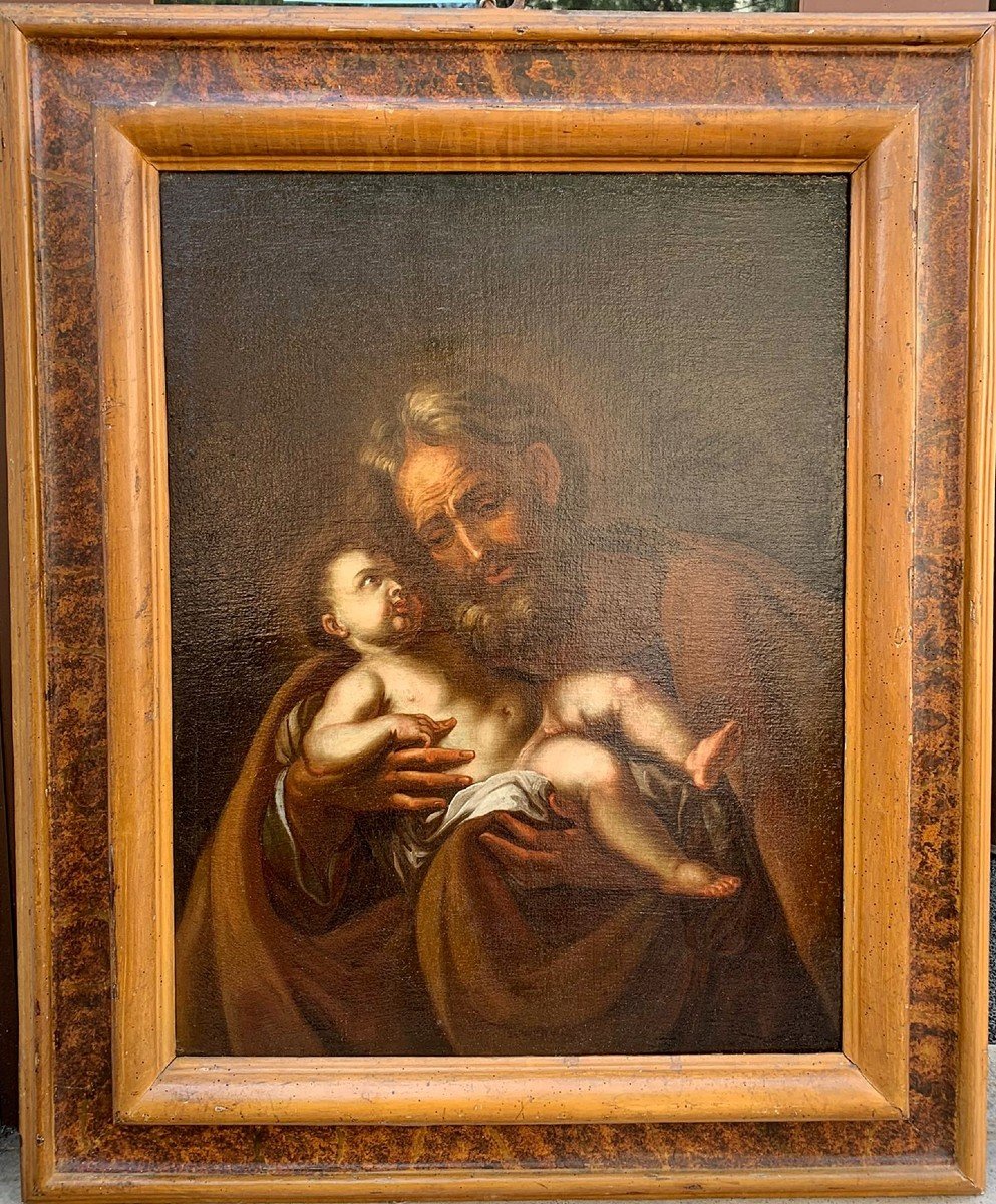 San giuseppe e Gesù bambino, olio su tela del seicento su cornice di origine a finto marmo.
