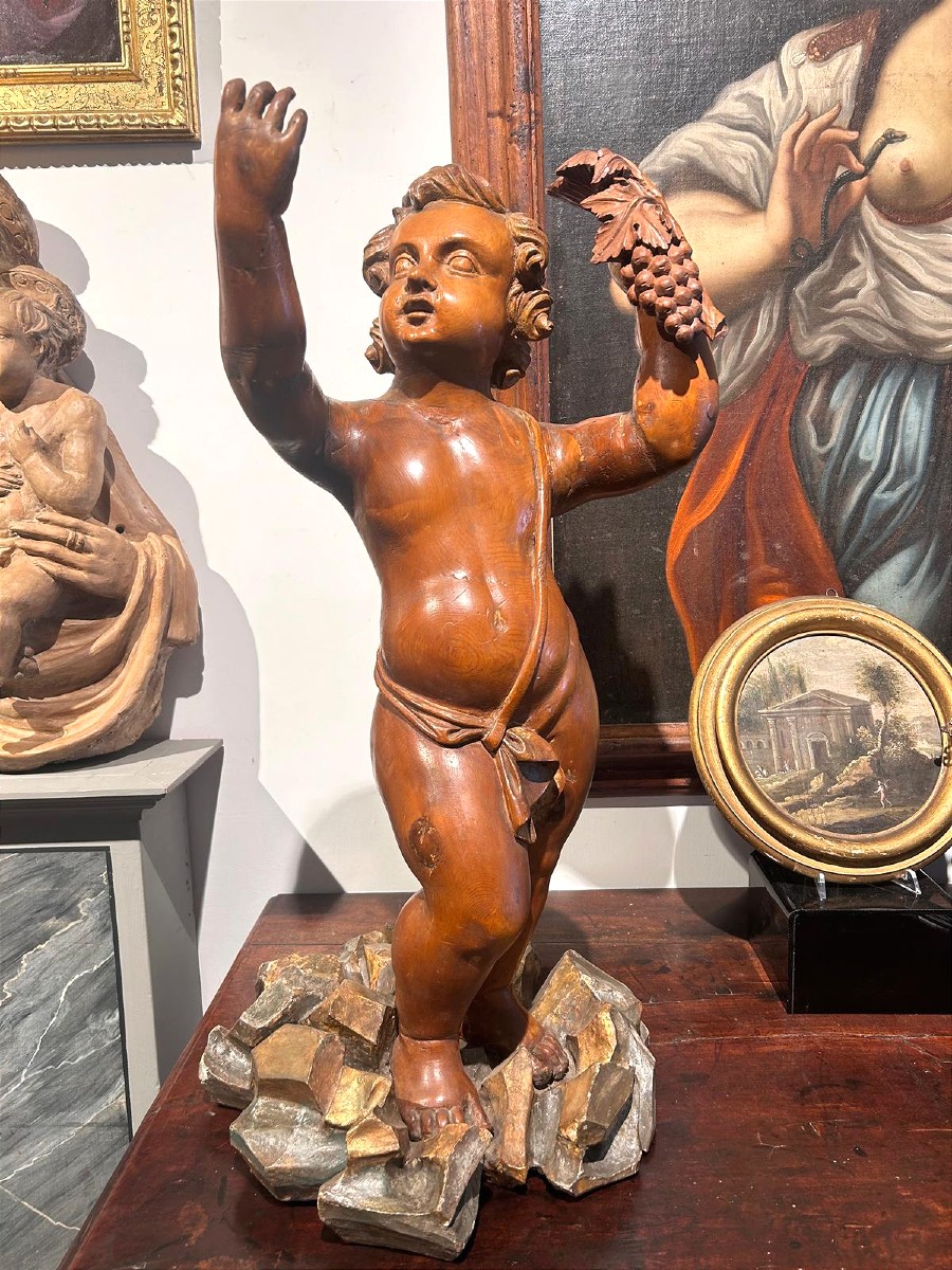 Scultura in legno di cirmolo allegoria bacchica. (72cm alt.)