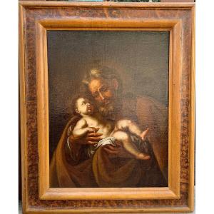 San giuseppe e Gesù bambino, olio su tela del seicento su cornice di origine a finto marmo.