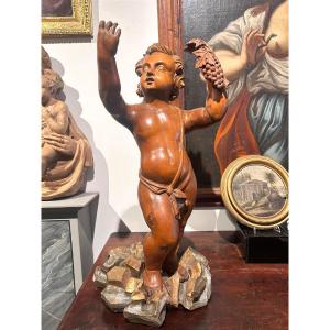 Scultura in legno di cirmolo allegoria bacchica. (72cm alt.)
