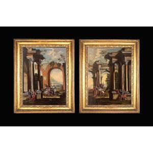 Coppia di capricci architettonici con scene bibliche e cornici romane coeve.