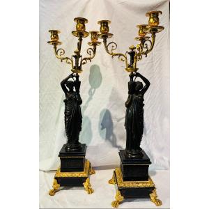 coppia di candelabri in bronzo dorato e base in marmo nero con piedini dorati XIX secolo