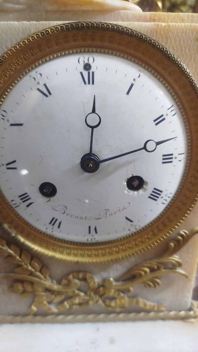 Orologio in marmo e porfido decorato con una vestale in marmo. inizio del XIX secolo-photo-1