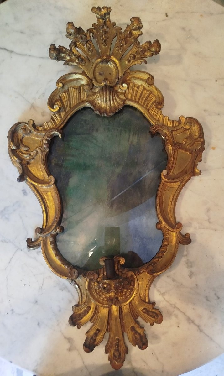 Gruppo di quattro ventoline in legno intagliato e dorato, XVIII secolo