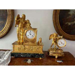 Orologio “ai cuori battenti” in bronzo dorato – Cupido con tamburo