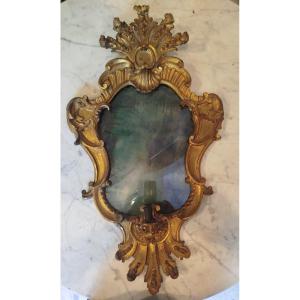 Gruppo di quattro ventoline in legno intagliato e dorato, XVIII secolo