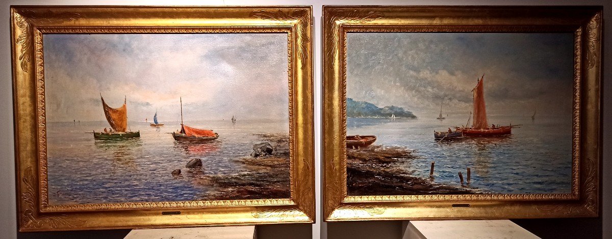 Coppia di paesaggi costieri napoletani con barche e pescatori.