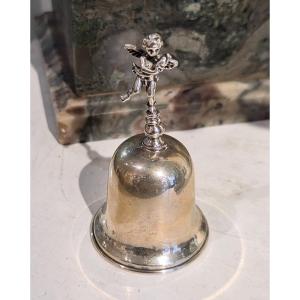 Campanellino in argento da tavolo con putto e tritone