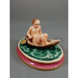 Majolica, Figure Of A Naked Young Girl In A Boat, Circa 19th Century.