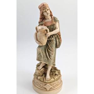 Antique Porcelain Figurine Of A Water Carrier From The Royal Dux, 19th Century