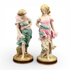 Royal Worcester Porcelain Figures By James Hadley, “before The Wind” & “against The Wind”