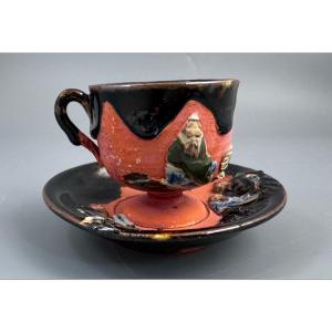 Japanese Sumida Gawa Cup And Saucer With Applied Sage Figures, Attributed To Ishiguro Kōko
