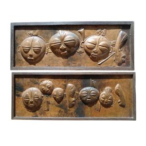 2 Bas Relief Panels In Repoussé Copper Depicting A Series Of African Masks