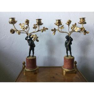 Candelabra In Gilt And Patinated Bronze Putti Holding A Bouquet Of Roses
