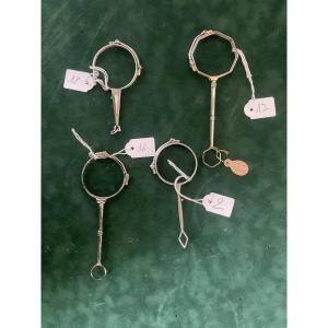 Silver Binoculars In Front Of Hands