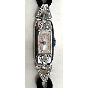 Orologio da polso da donna, in platino e diamanti taglio brillante di kt. 0,30.