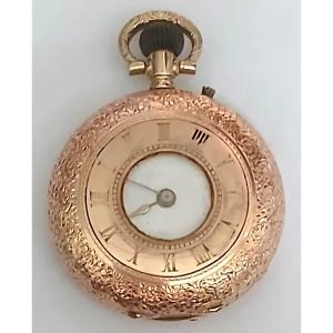 Orologino svizzero  da donna cesellato in oro 12 kt - 'occhio di bue' - funzionante.