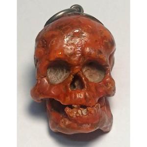 Teschio scolpito da grosso ramo di Corallo. Vanitas scaramantica trapanese del XVII secolo.