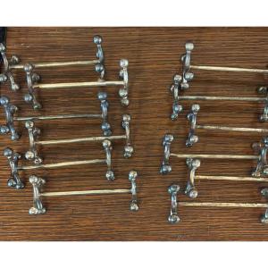 12 Silver-plated Metal Knife Rests, Early 20th Century