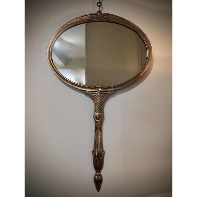Wall Mirror In The Shape Of A Hand Mirror.