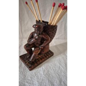 Pyrogenic Lumberjack At Rest With His Carved Wooden Hood 