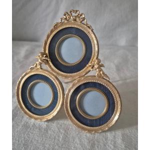 Gilded Bronze Triptych Photo Frame With Round Views And Mat Accompanied By Cherubs