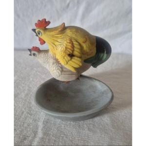 Pocket Ashtray With Hen And Rooster Suspended For A Rocking Effect