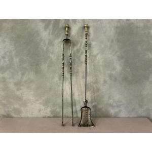 A Set Of An Antique Iron And Bronze Fireplace Shovel And Tongs Dating From The 19th Century