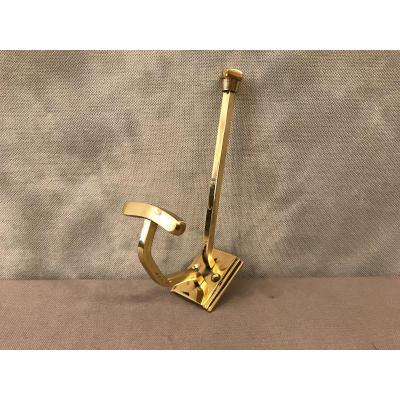 Coat Hook In Polished Brass And Vintage Varnish Around 1900.