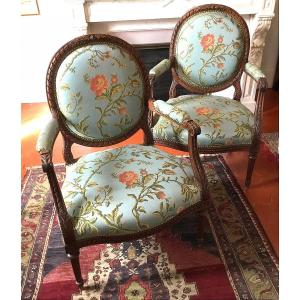 Pair Of Louis XVI Style Medallion-back Armchairs In Molded And Carved Wood