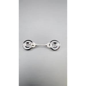 Art Deco Frill Brooch In Platinum, Diamonds, And Onyx.