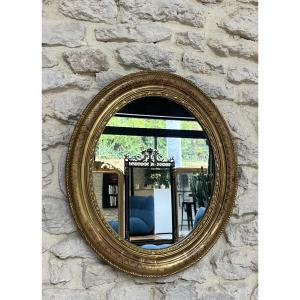 Antique Oval Mirror Gilded With Gold Leaf And Geometric Decorations, 