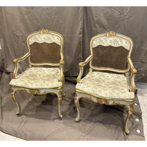 Coppia di poltrone in legno laccato e dorato