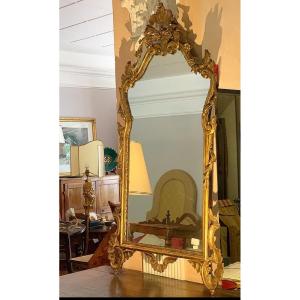 Specchiera italiana periodo ottocento con cornice foglia oro.